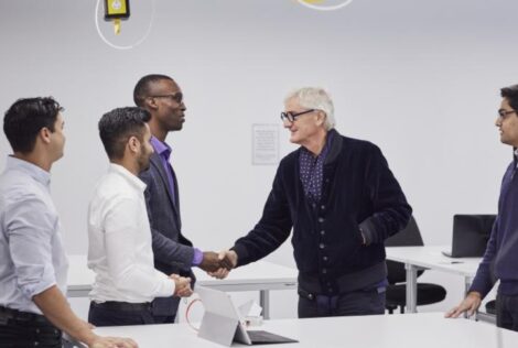 McMaster Engineering Alumni shaking hands with people from sKan