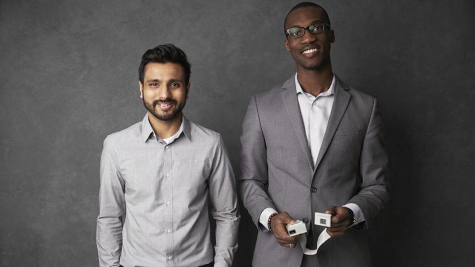 Picture of two MacEng Students posing with their device