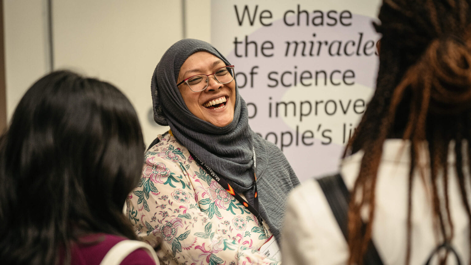 A person laughs at a women in engineering industry networking event.