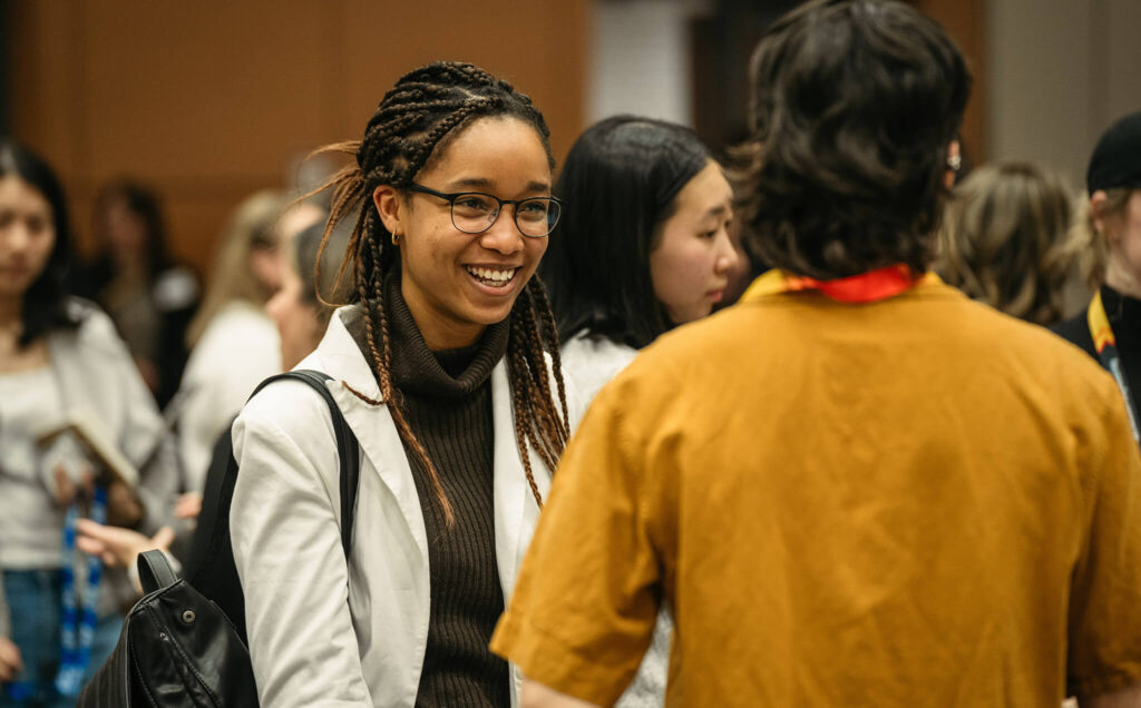 Someone smiles while networking at the women in engineering industry event.