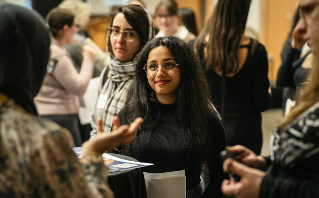 Women network at a women in engineering industry event.
