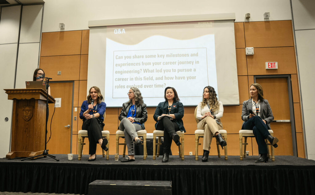 A panel of women sit on stage at the women in engineering industry event.