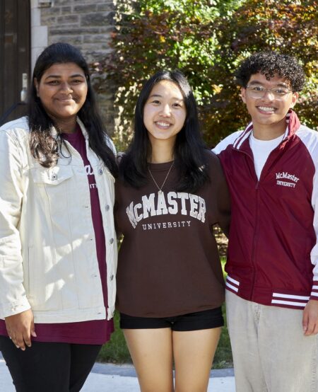 Fariha, Ursula and Dominick posing on campus