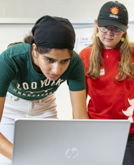 EMBER students working around the computer