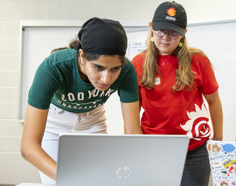 EMBER students working around the computer