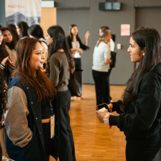 Student networking with an employer.