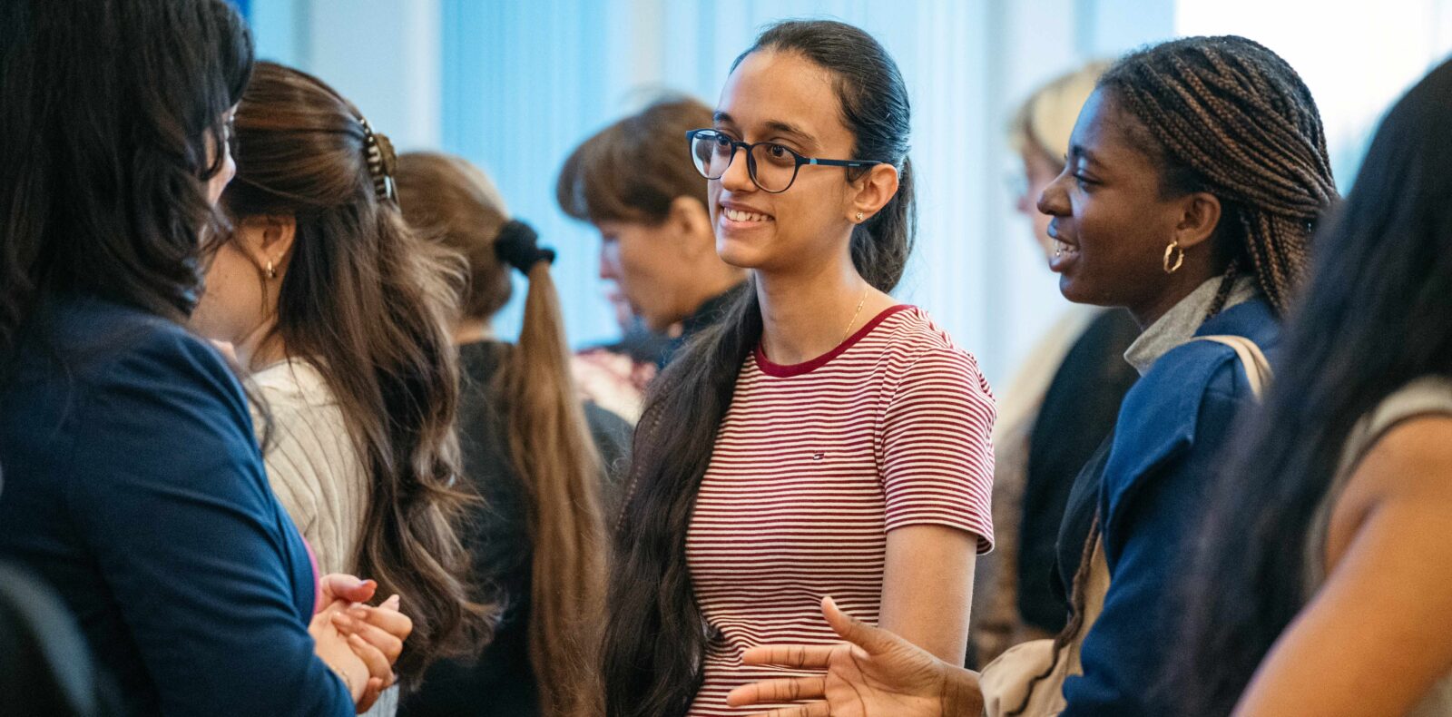 Students networking in a crowd.