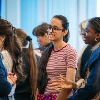 Students networking in a crowd.