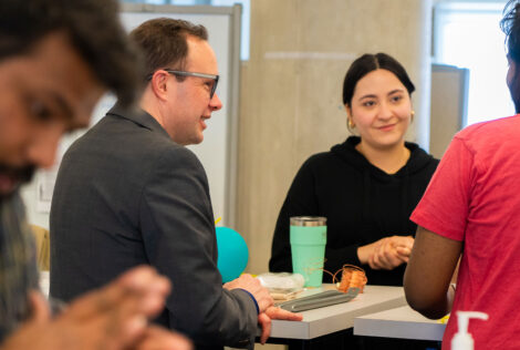 professor in classroom with graduate students