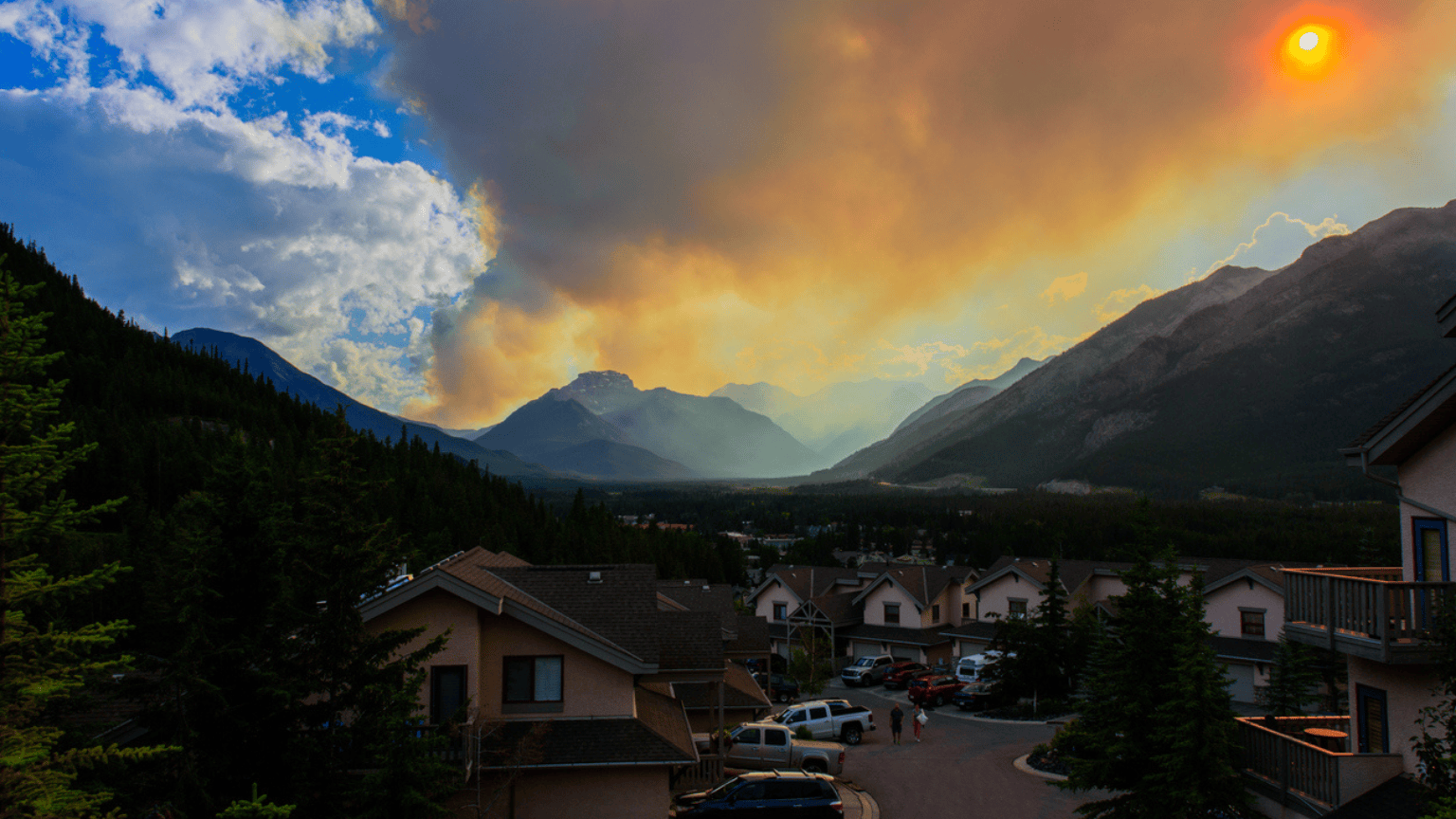 Wildfire flames in the sky over a Canadian town