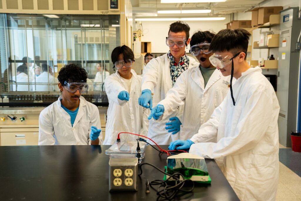 group of camp students working together in the lab workshop