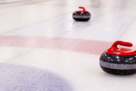 Curling rocks resting on a sheet of ice