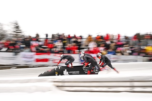 Bobsleigh team, including Mark Zanette, about to jump into the bobsleigh during a race
