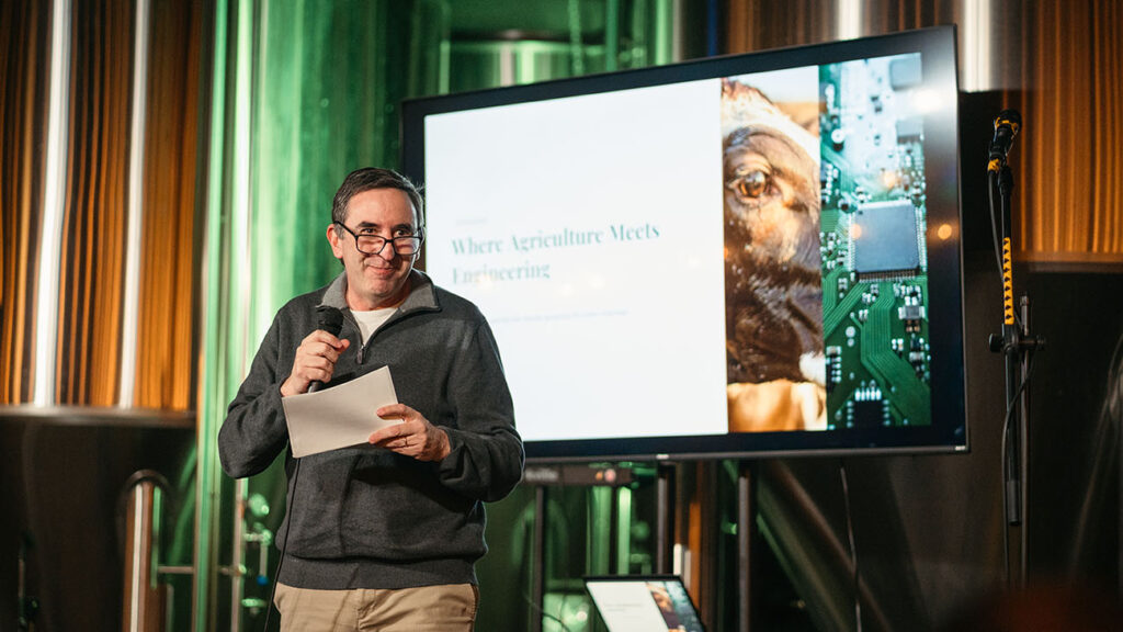 Dr. Carlos Filipe from McMaster University speaking to guests at the event