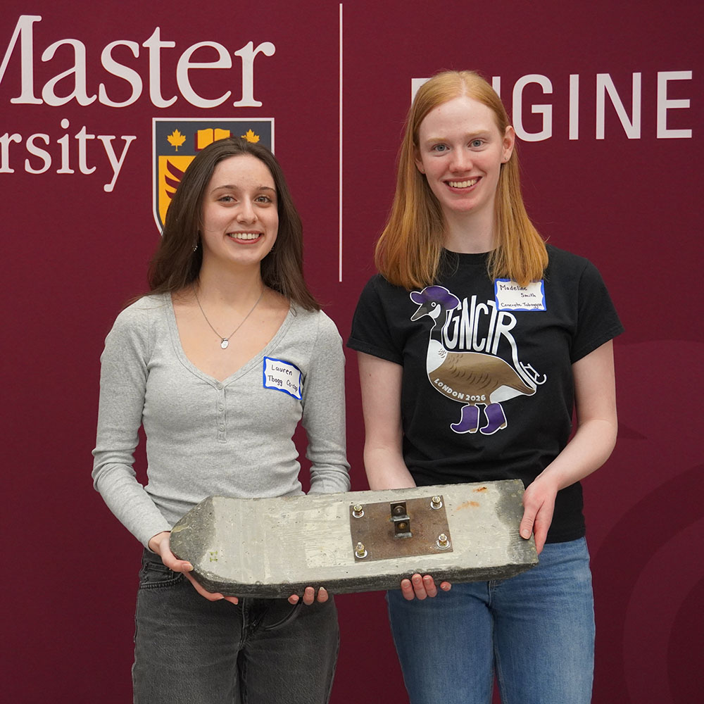 Two members of the Concrete Toboggan Team smiling together