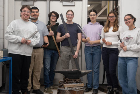 Members of the MacSmith standing in the Blacksmithing Lab