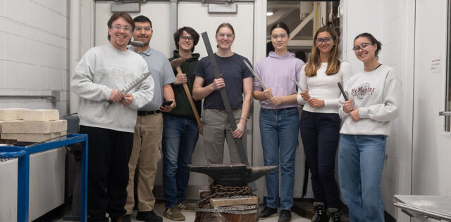 Members of the MacSmith standing in the Blacksmithing Lab