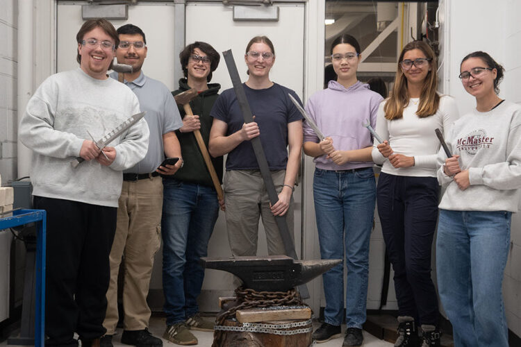 Members of the MacSmith standing in the Blacksmithing Lab