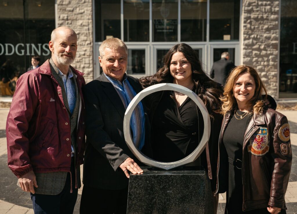Nicole poses with her family at the iron ring