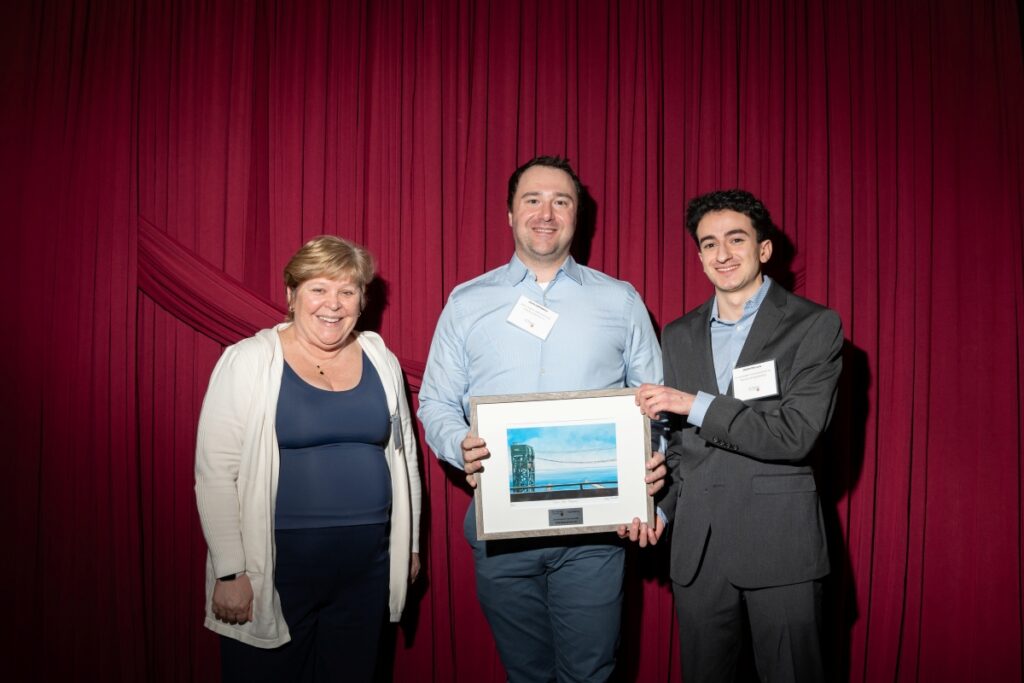 Two Vitalbio employees pose with Heather Sheardown