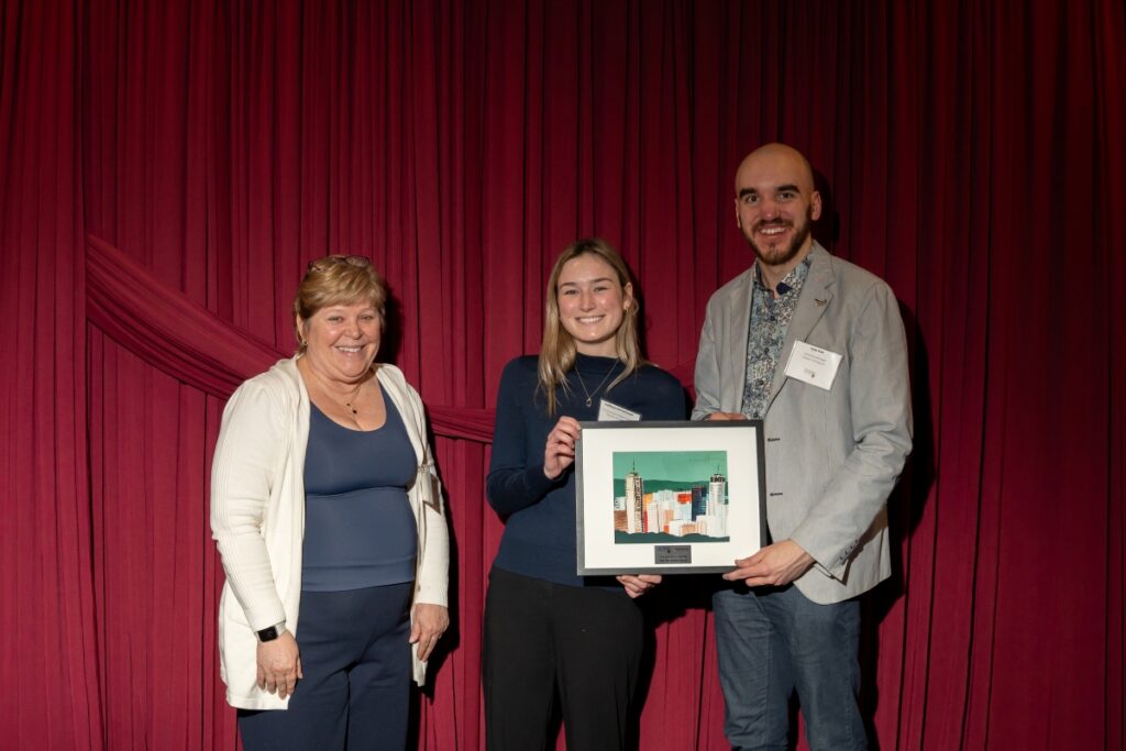 Two Walters Group employees pose with Heather Sheardown