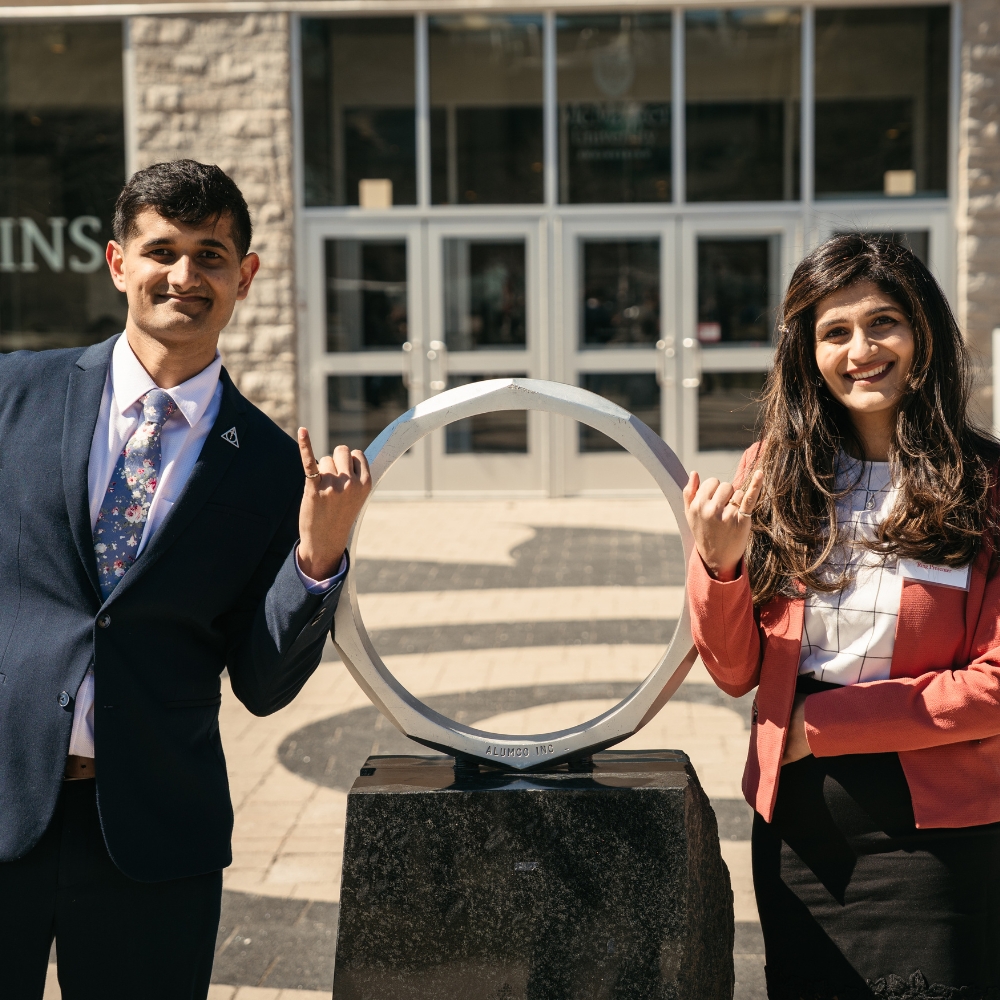 Aryan and Archie pose at the Iron Ring statue