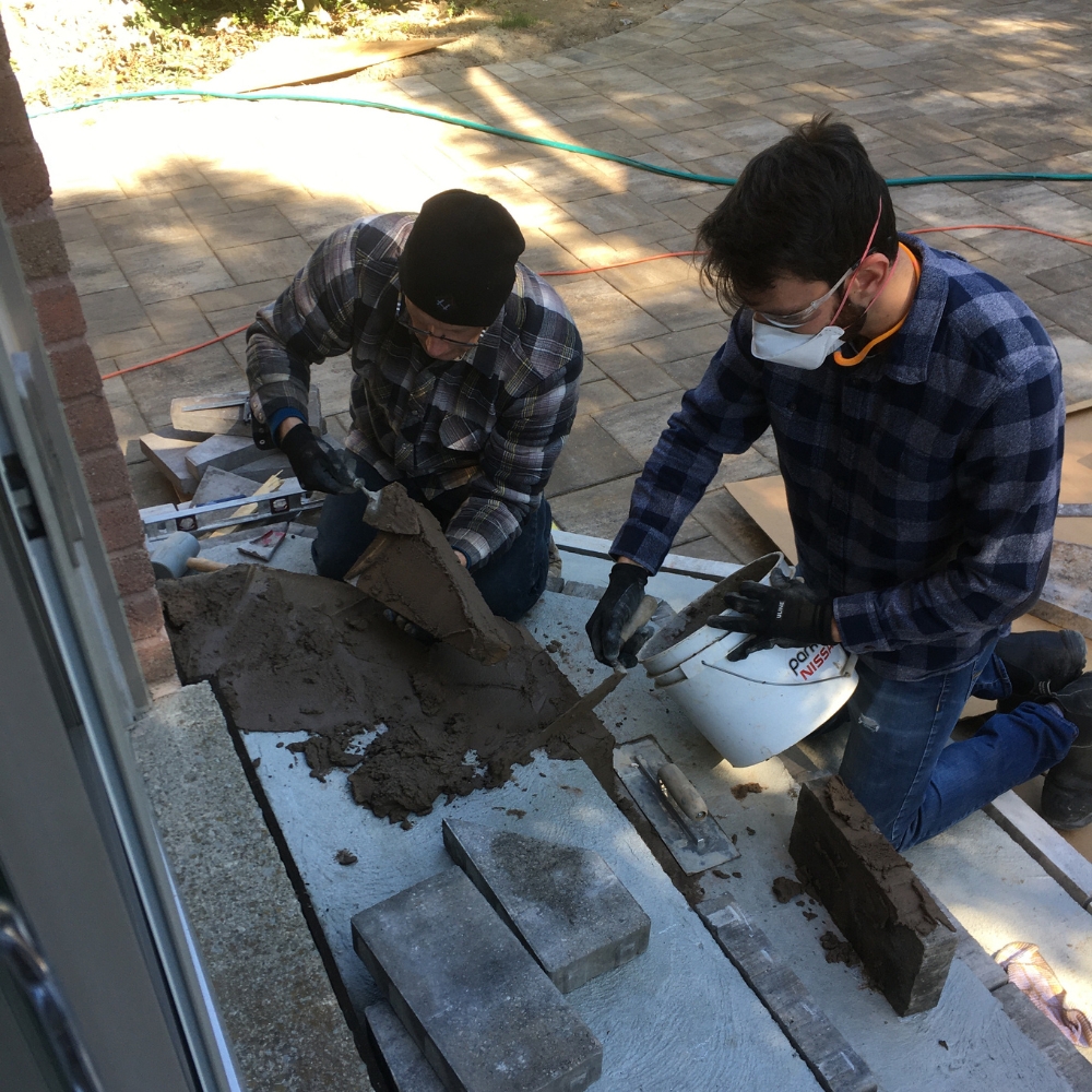 Nathan and Stephen working on a concrete stair way