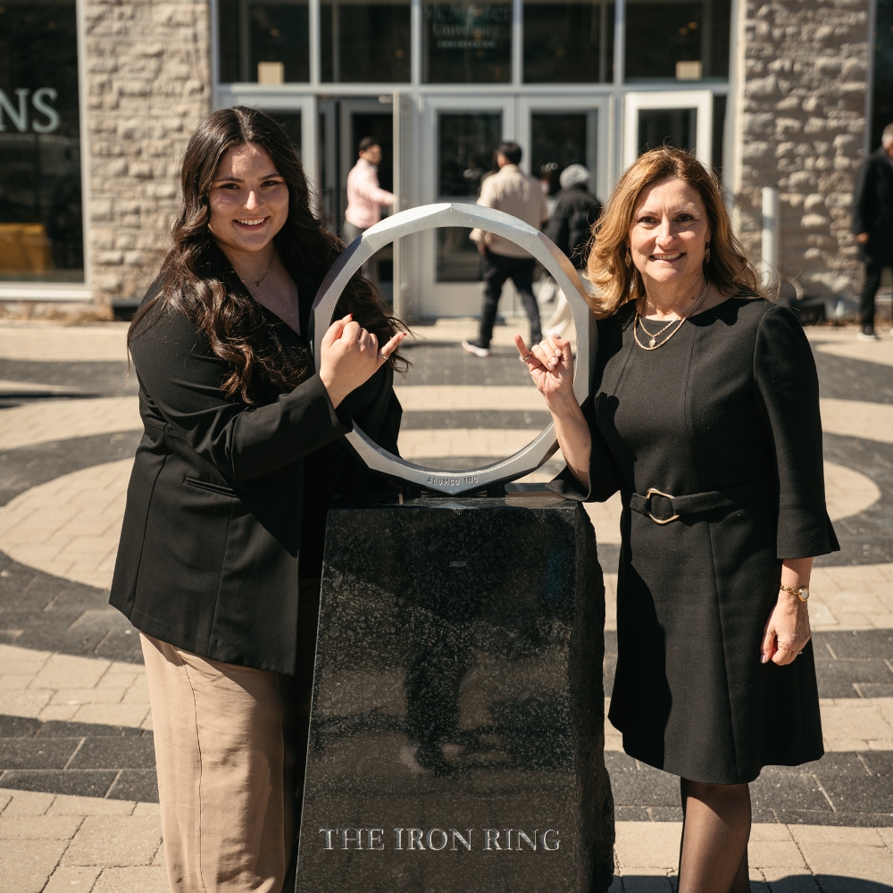 Nicole and Marlene pose at the Iron Ring statue