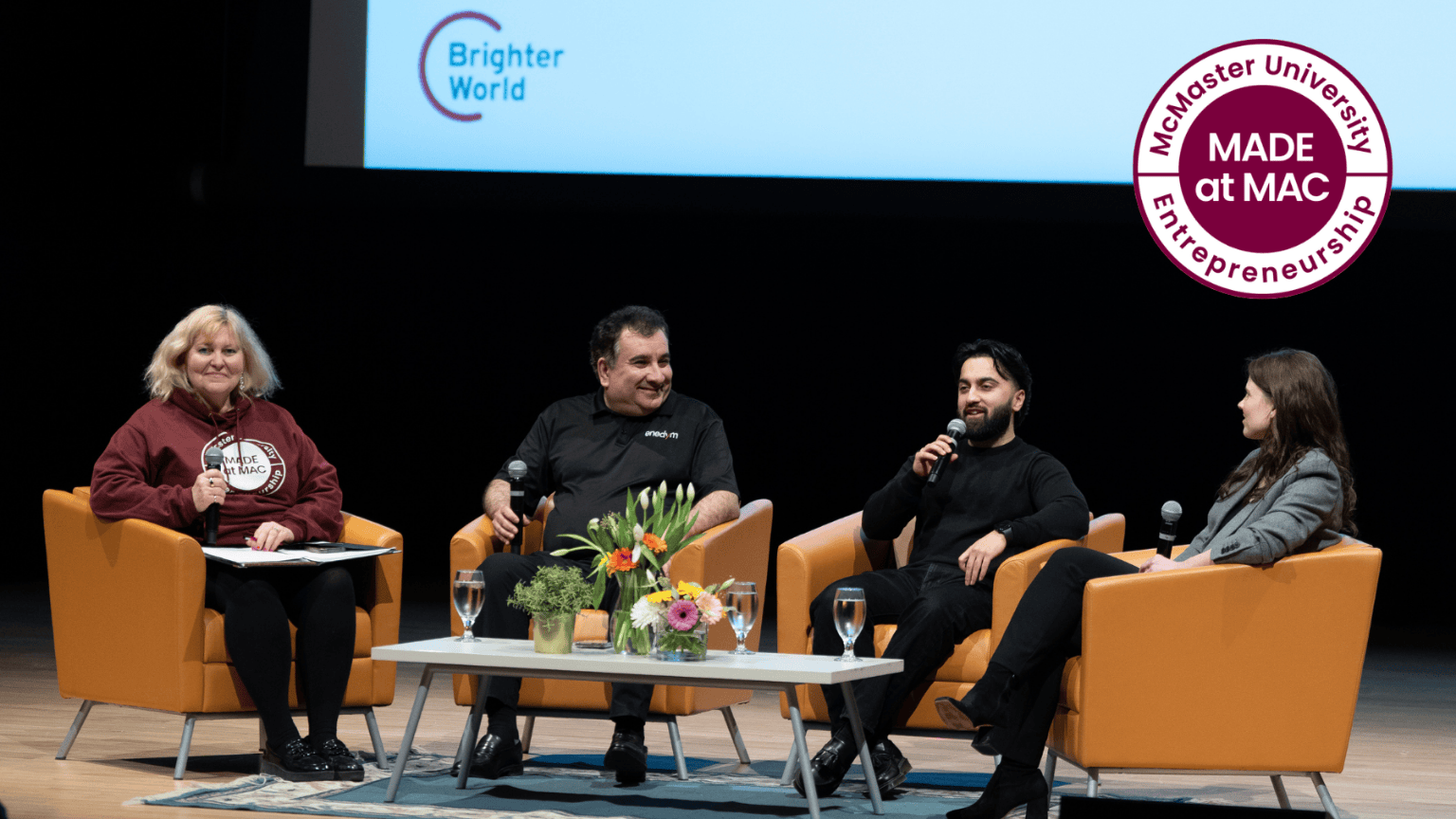 Panelists sit on stage. From left to right: Susan Tighe, Ali Emadi, Manak Bajaj, and Mackensey Bacon.