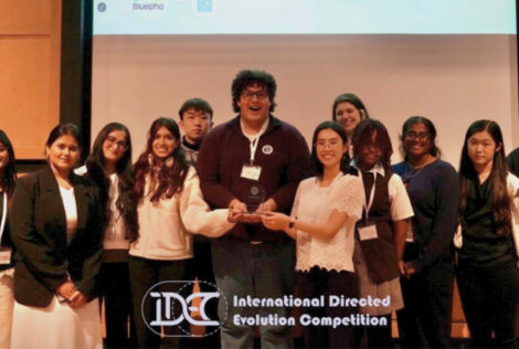 Members of the BioDesign team pose together holding their third place award from an international biomedical competition