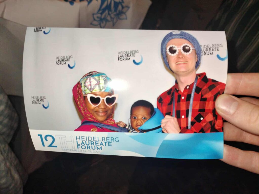 Chris, Aisha and Halima in a photobooth photo