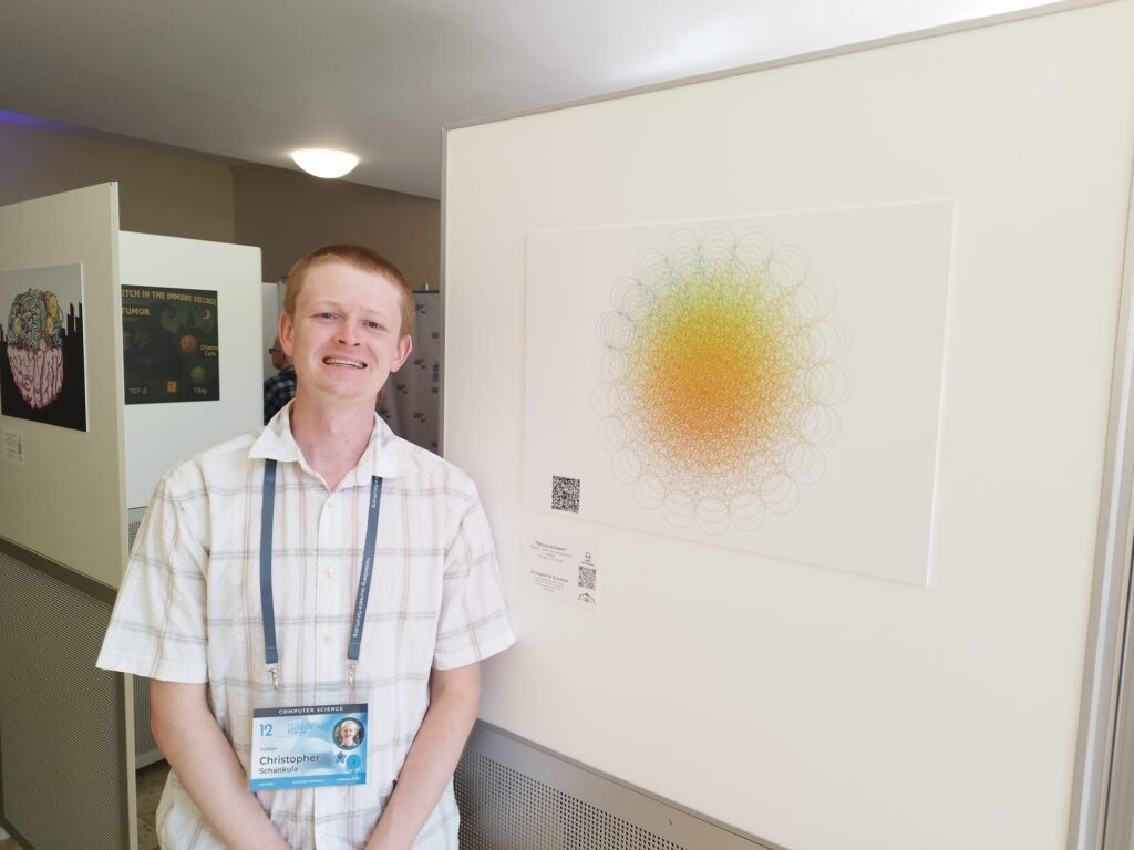 Chris posing with his artwork that looks like a sun