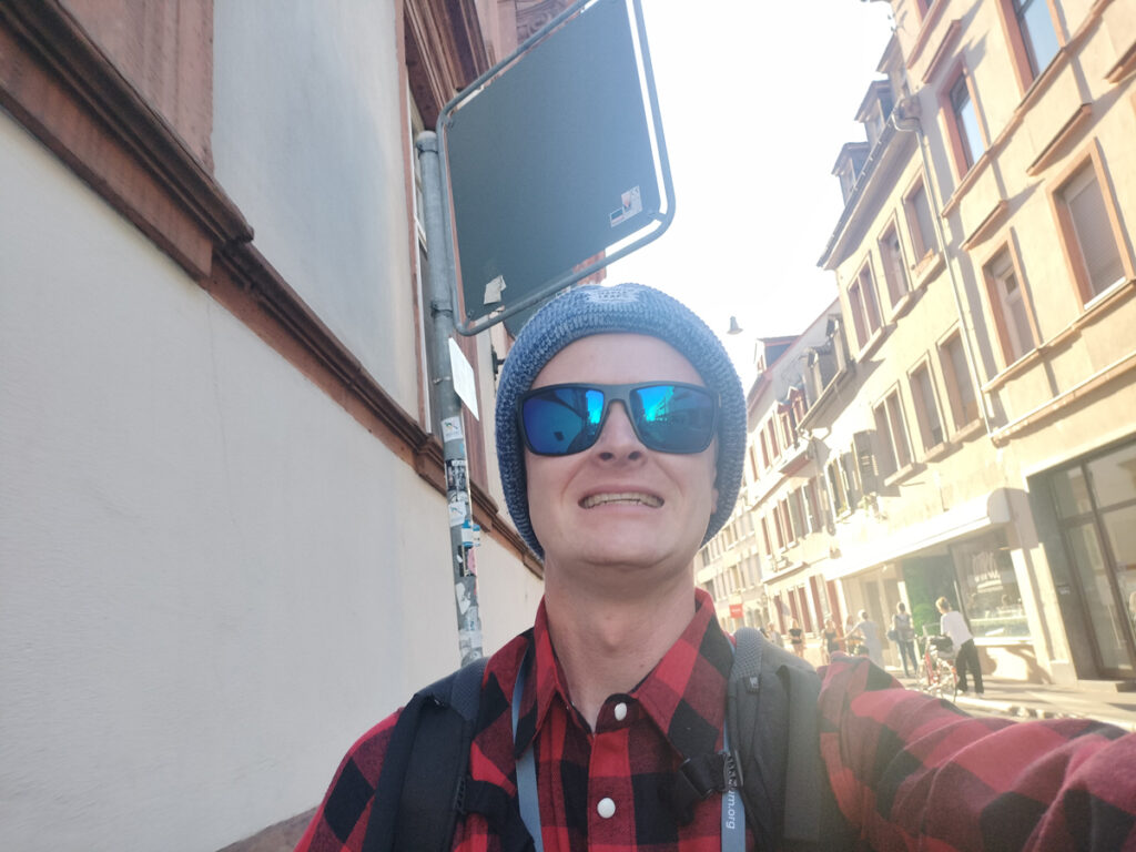 Chris wearing his Canadian inspired outfit of red plaid and a beanie