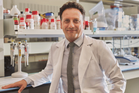 Tohid Didar leans on a counter in a lab coat.