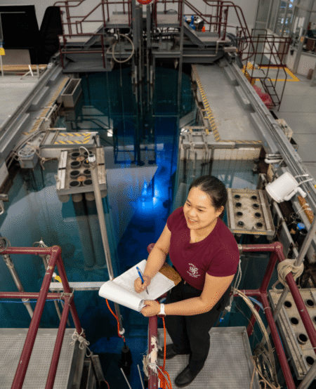 Someone stands by the nuclear reactor with a checklist