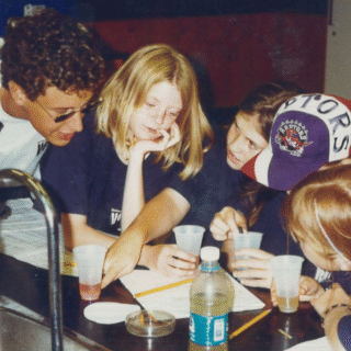 Staff member helping children at Venture Summer Camp in 1994