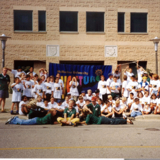 Students and staff posing outside of JHE for Venture Summer Camp in 1999