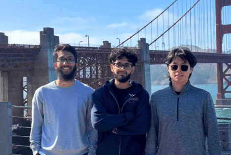 Ramin Syed, Arish Shahab and Aaron Yu stand in front of the Golden Gate bridge.