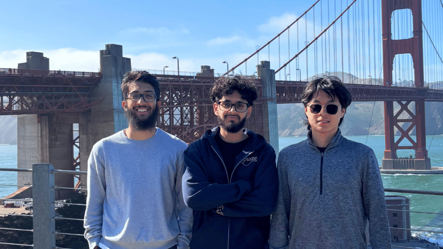 Ramin Syed, Arish Shahab and Aaron Yu stand in front of the Golden Gate bridge.