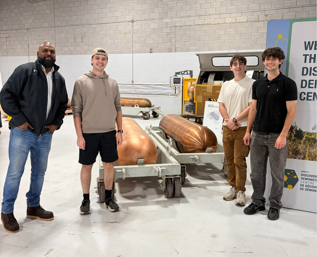 Course instructor and McMaster students pose inside the Nuclear Waste Management Organization. 