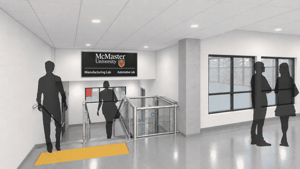 People use the stairs and have a conversation by the automotive lab (rendering).
