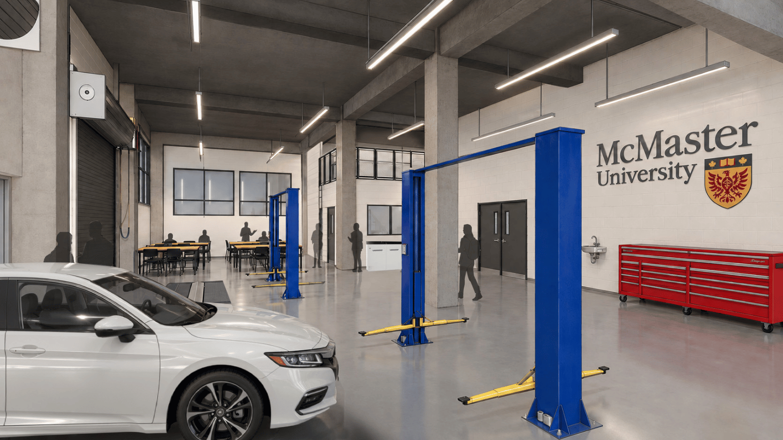 A rendering of the automotive lab with a vehicle on the left and McMaster logo on the wall.