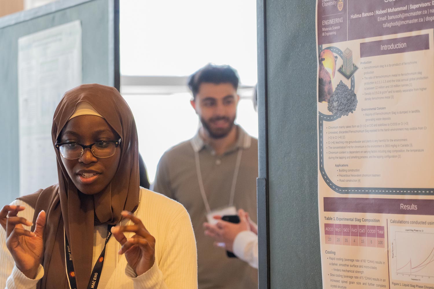 Halima chats with people around her poster