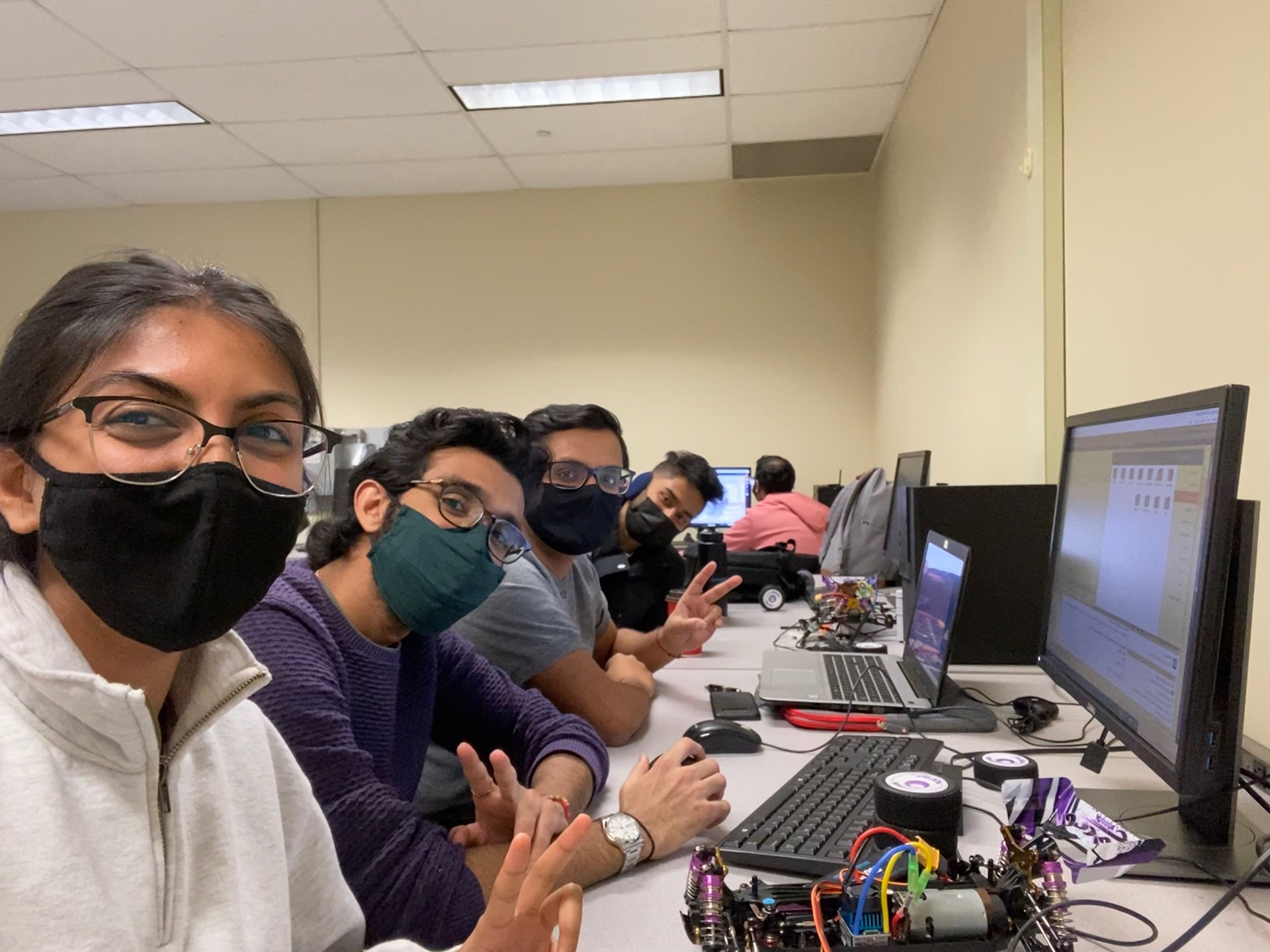 A group of masked McMaster engineering students in a classroom 