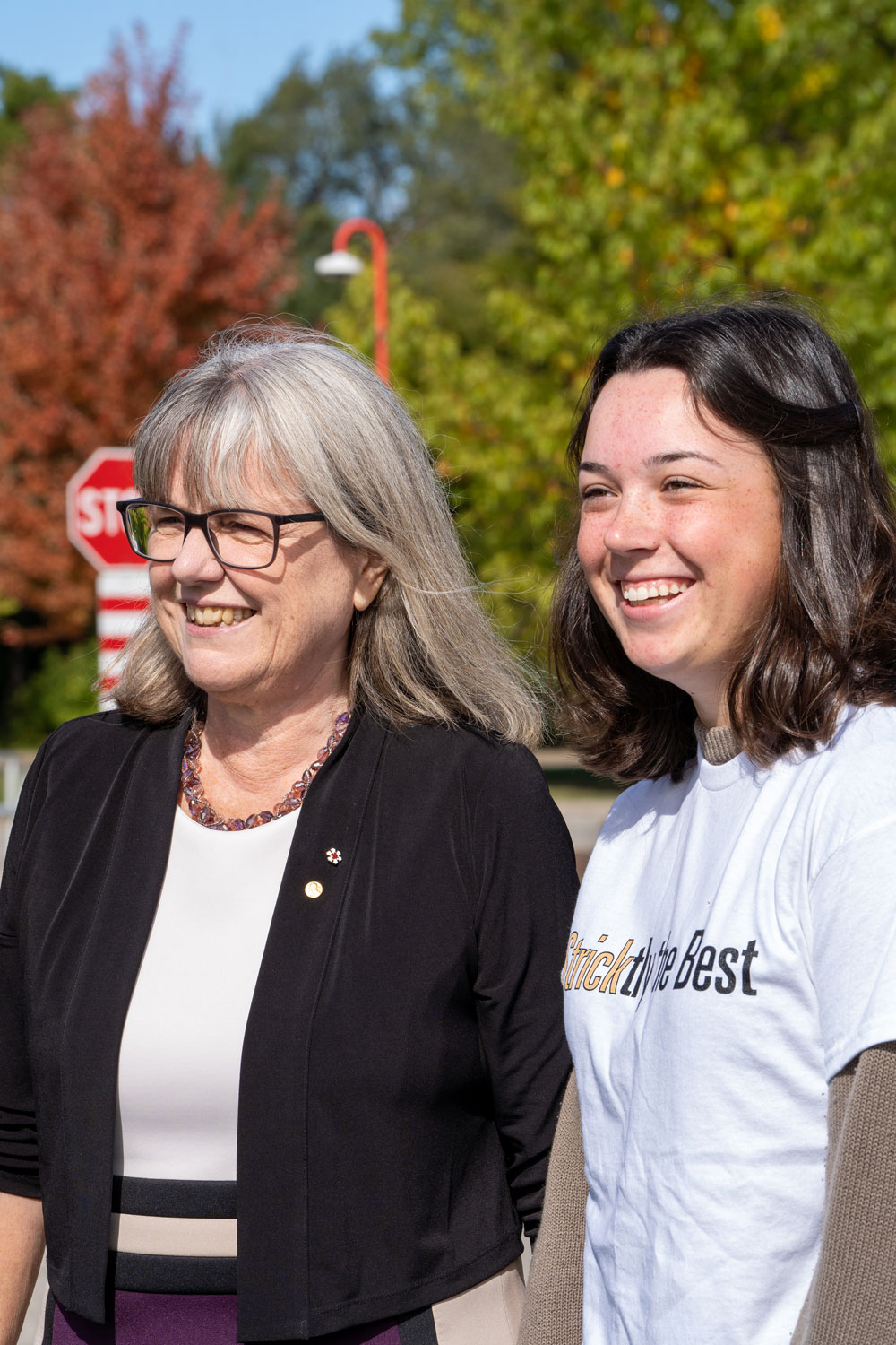 Donna Strickland stands with Emma Magee who is wearing a shirt that says Sticktly the best