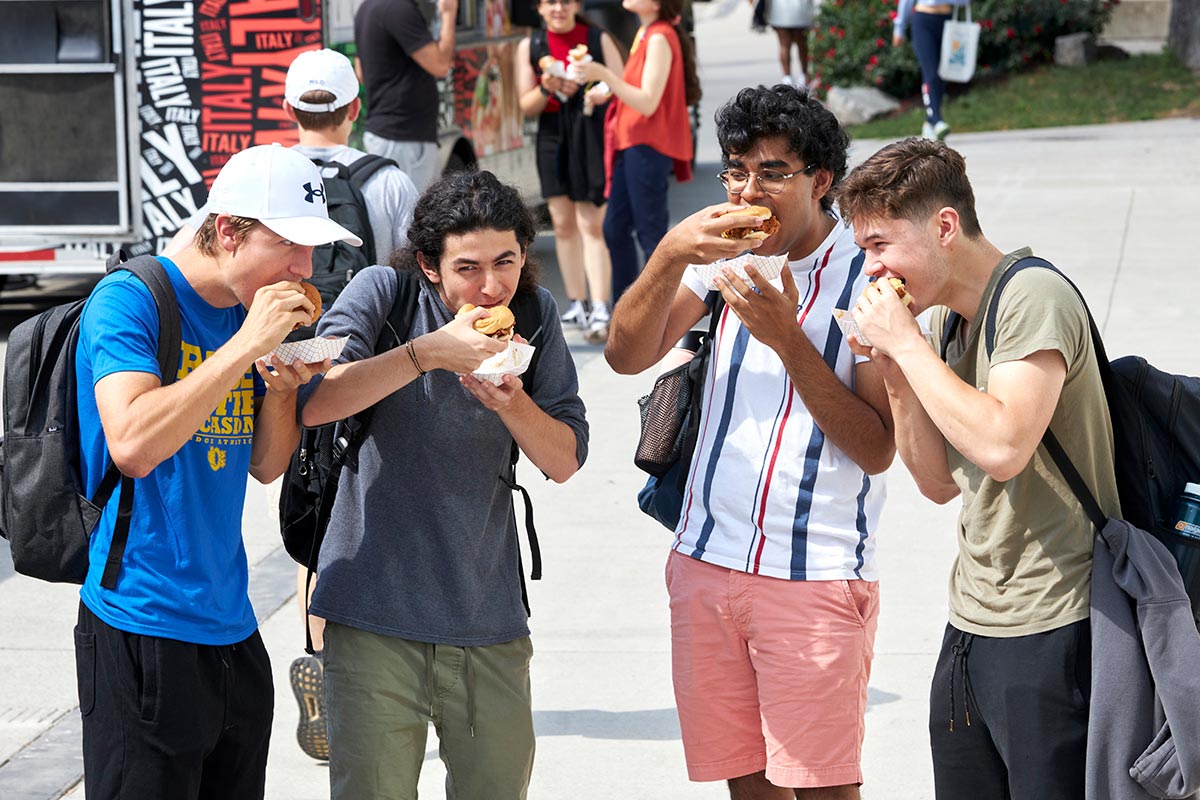 A group of students eat their sandwiches