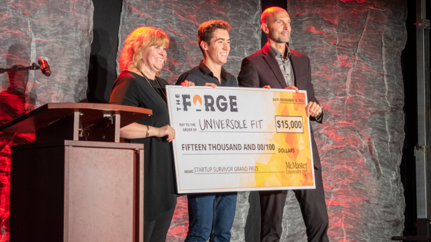 Joshua of Universole Fit poses with a large cheque from the Forge